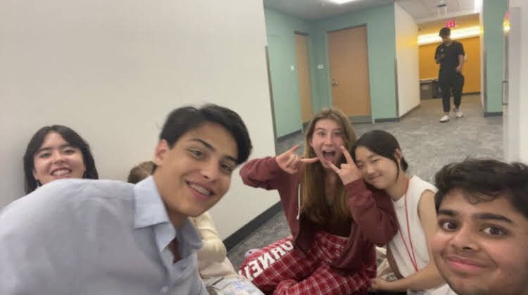 With fellow debaters in the dorm hallway at Cornell Summer Debate Camp