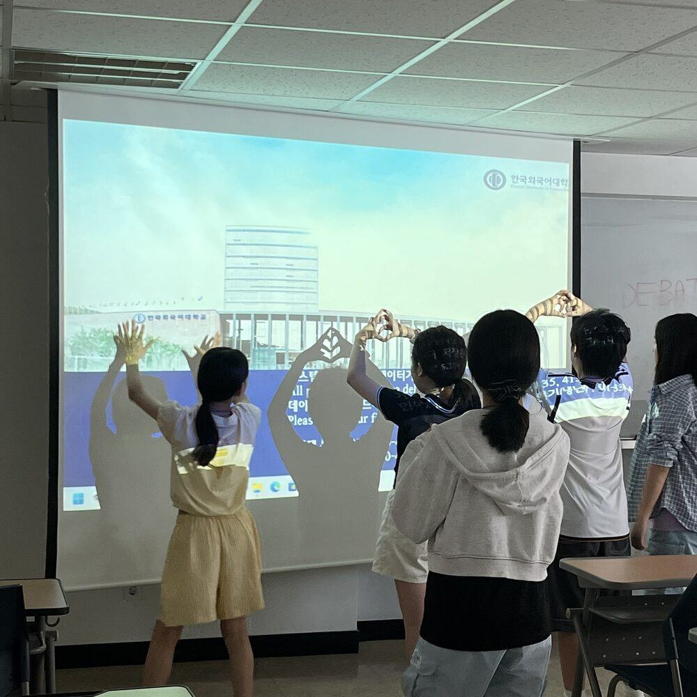 Students acting out a debate-related activity in class